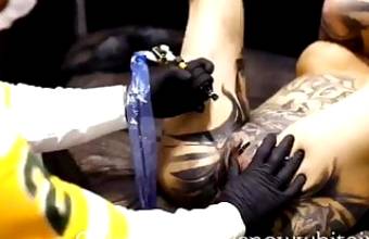 Crazy tattoo slut gets her butt hole tatted and suck 2 guys